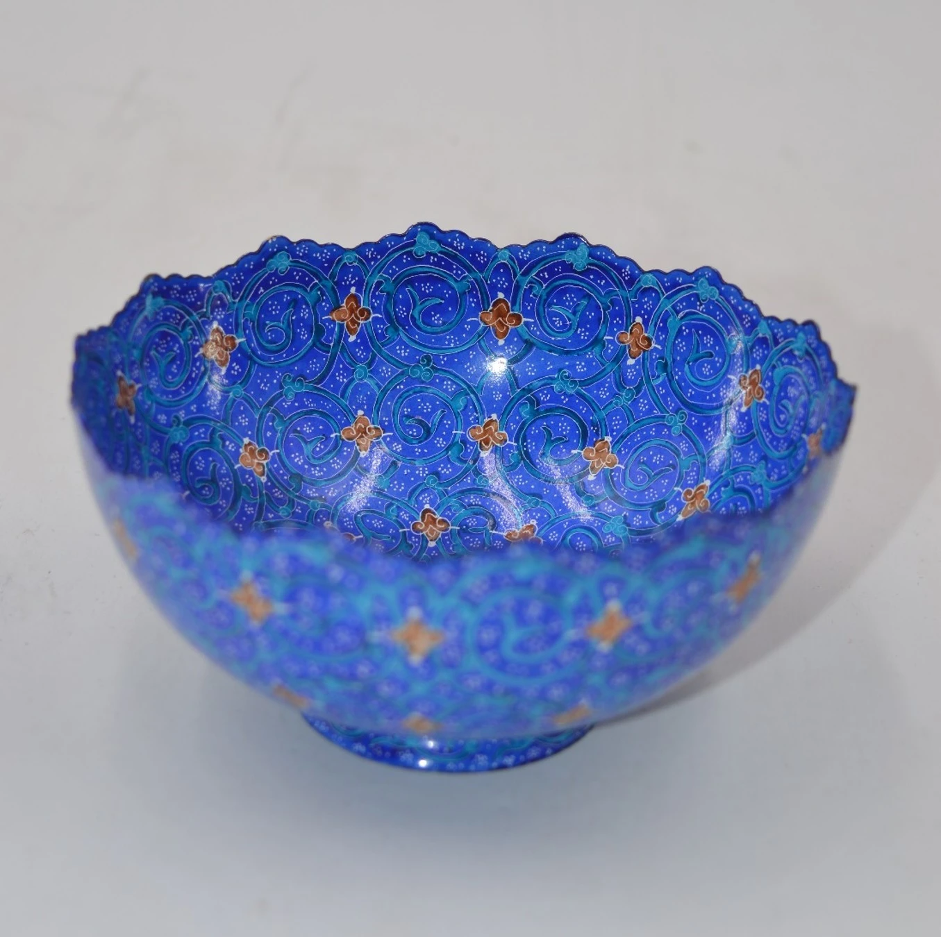 Footed plate with scalloped edges