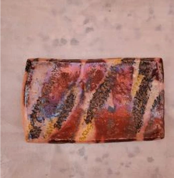 brown and earth-toned lusterware rectangular dish