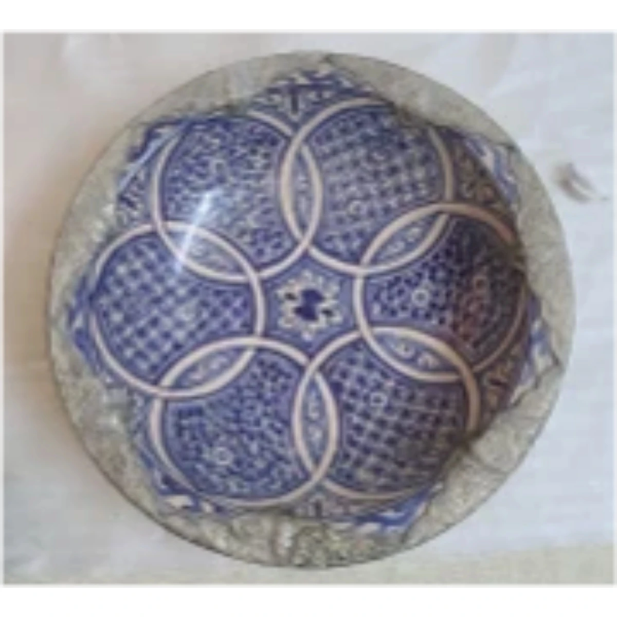 Large white  metal-mounted ceramic plate