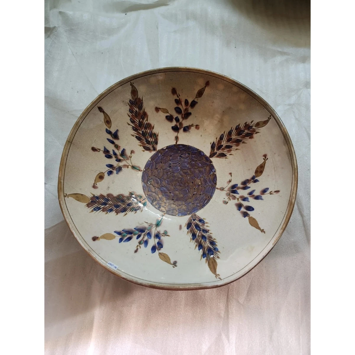 Polychrome beige and blue ceramic plate