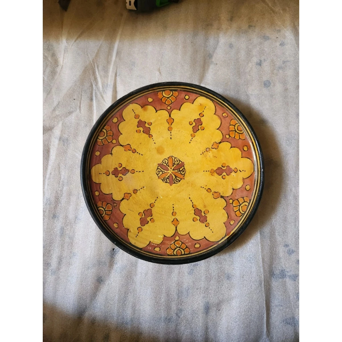 red and yellow ceramic dish