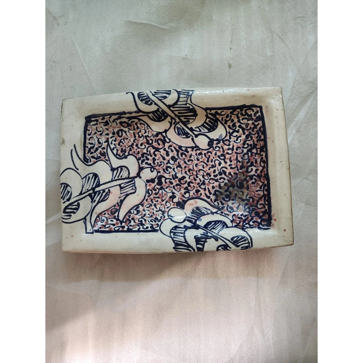 A rectangular lusterware dish