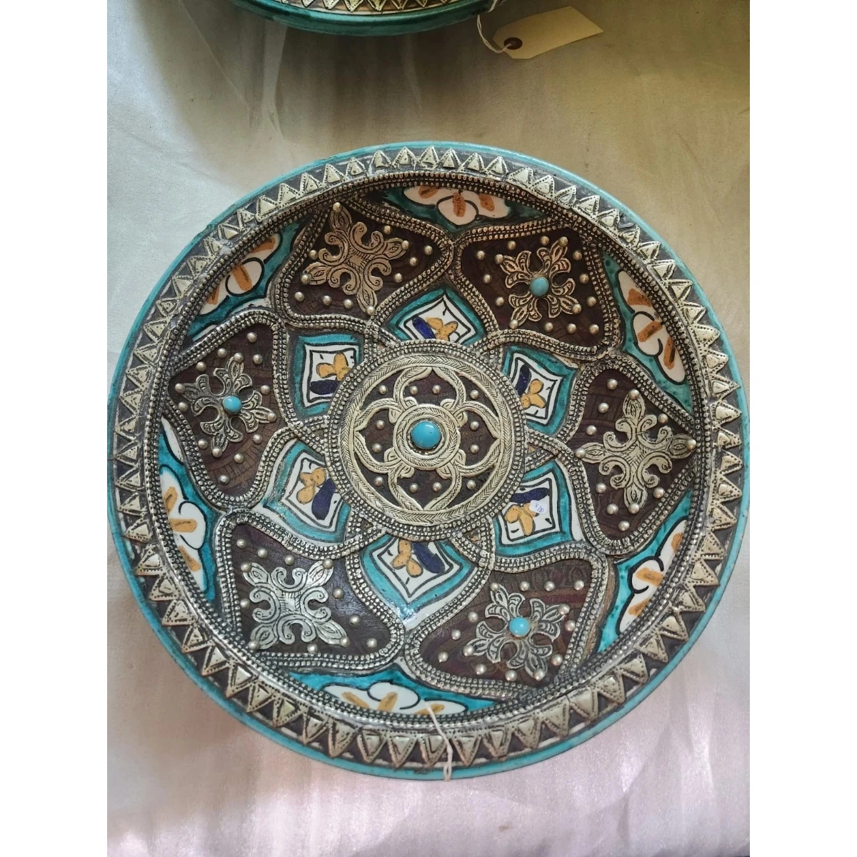 Large metal mounted polychrome ceramic plate