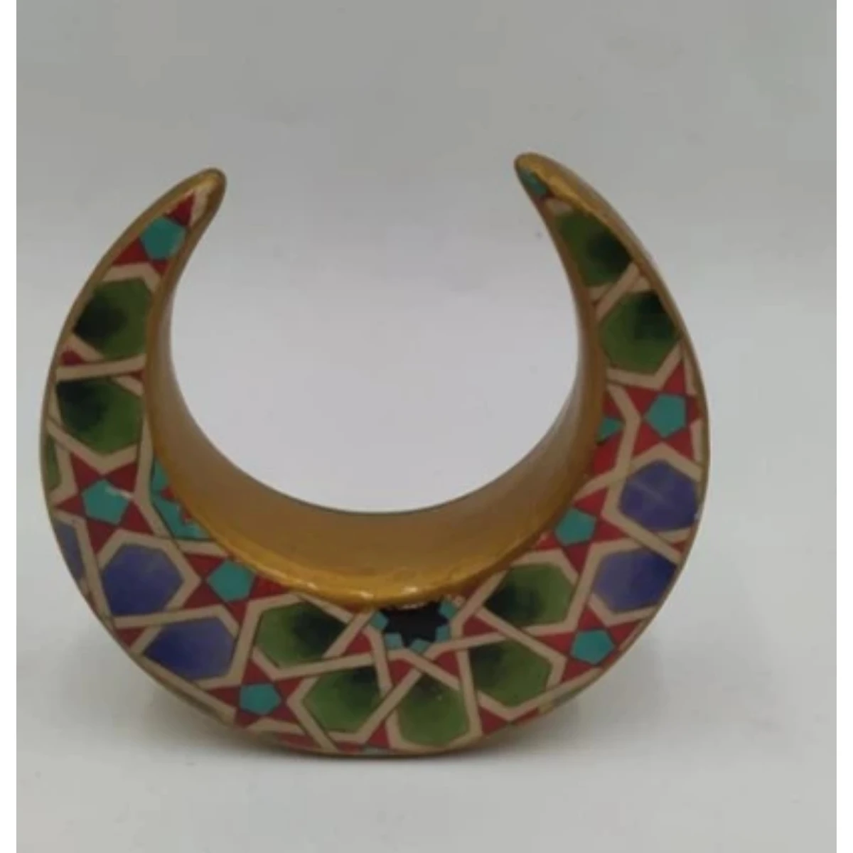 Ceramic crescent with a floral design